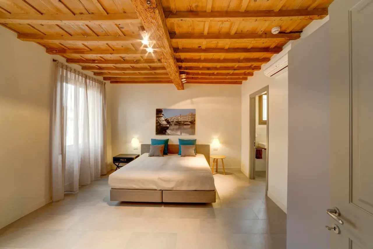 Master bedroom seen from the entrance of the Bilo Deluxe apartment.