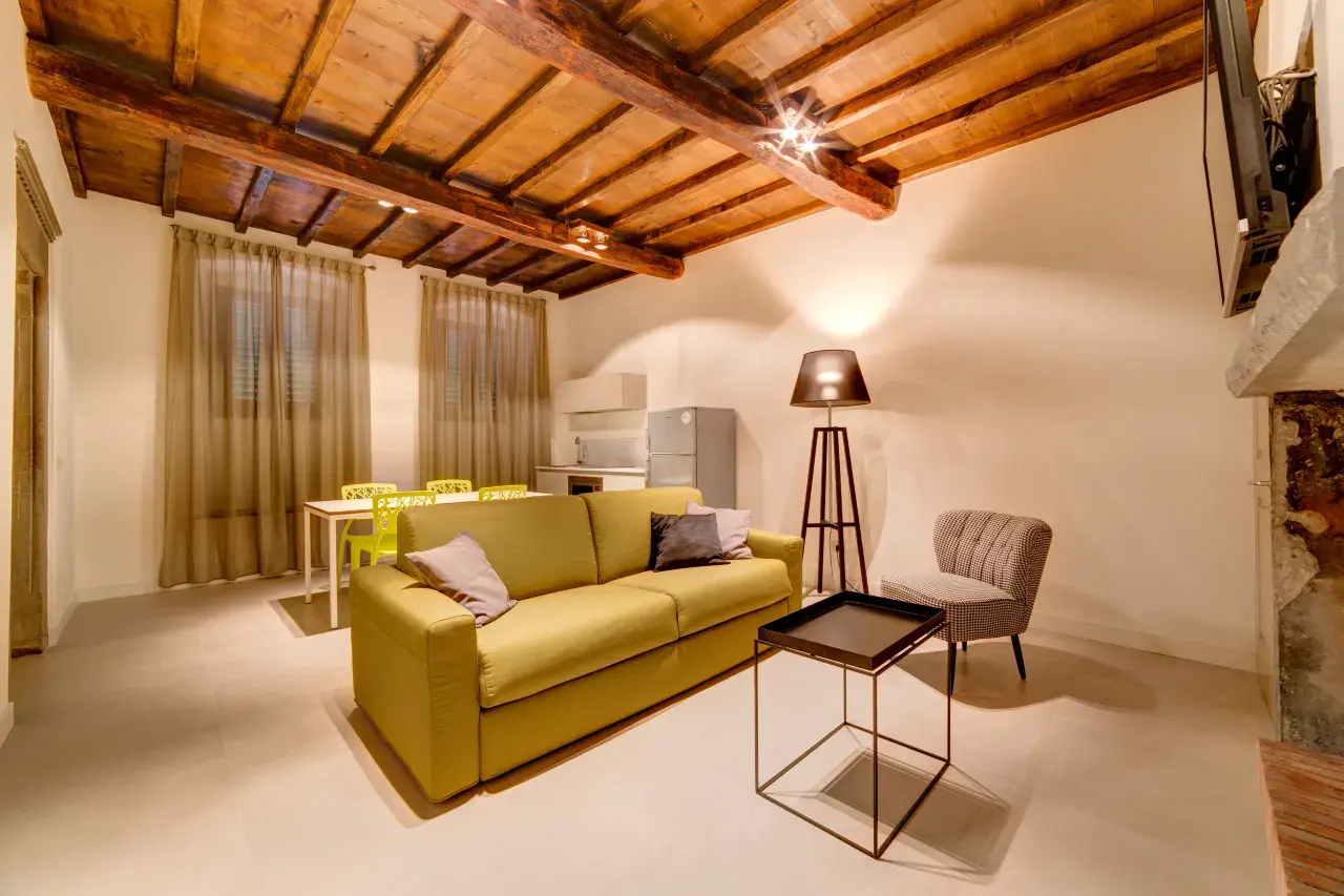 Living room and kitchen with dining table and chairs - Bilo Deluxe apartment.