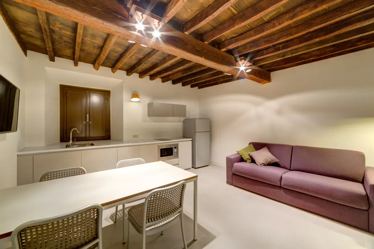 Overview of the living room in a Bilo Deluxe apartment at Palazzo Mannaioni.