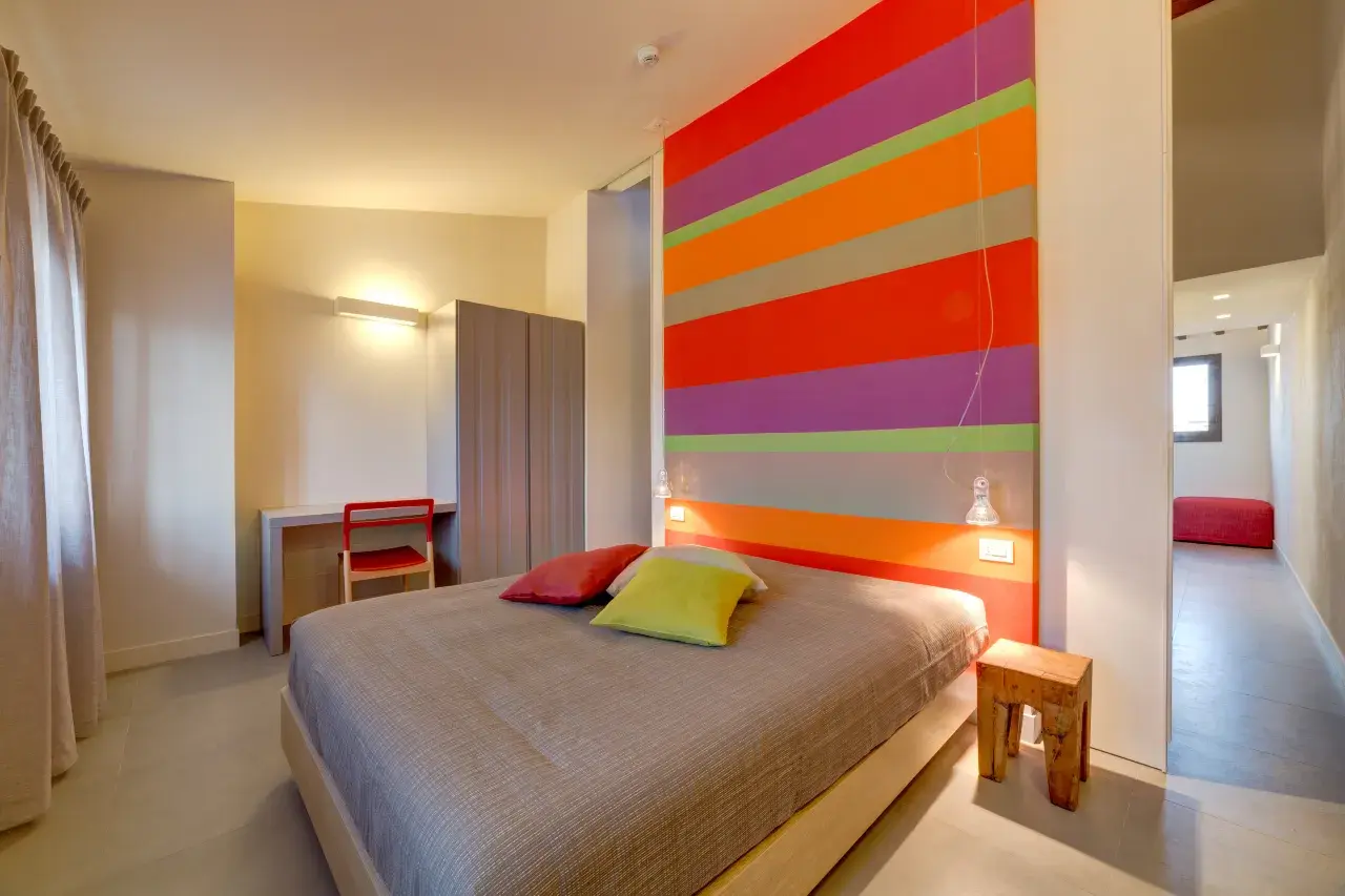 Bedroom of the Bilo View apartment at Palazzo Mannaioni, suites in Florence.
