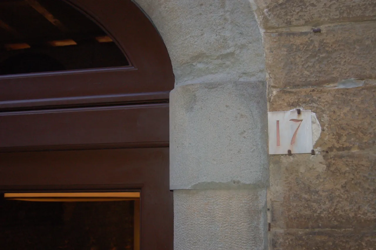 Red street number 17 of Palazzo Mannaioni, suites in Florence.