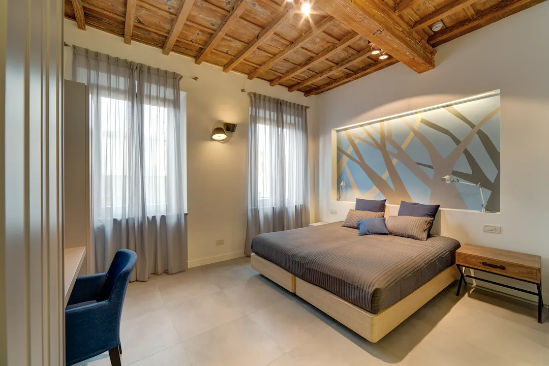 Representative bedroom of an apartment at Palazzo Mannaioni, suites in Florence.